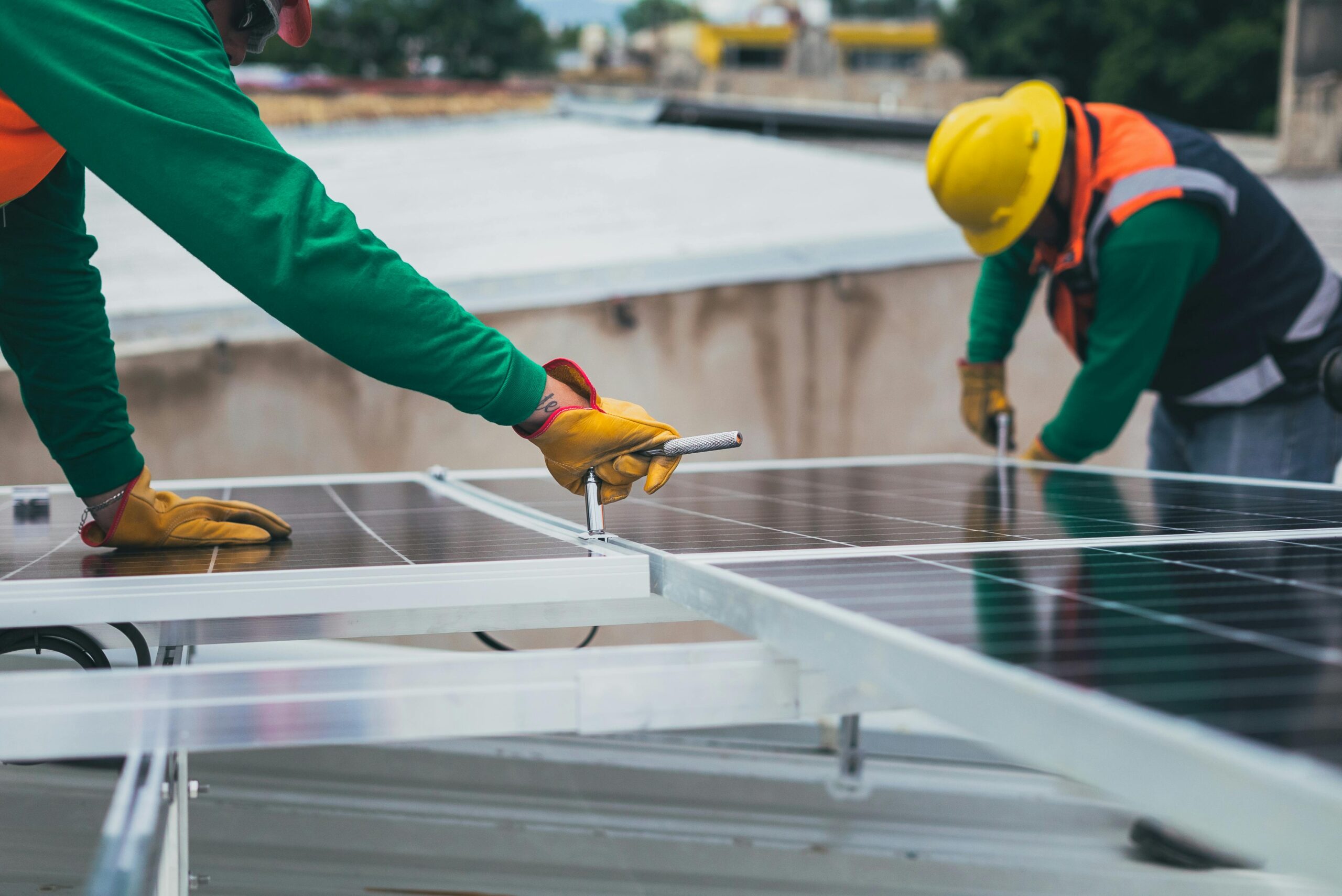 Professionals installing solar panels